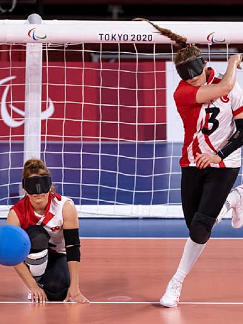 Goalball player Sevda Altunoluk stands and throws the ball 